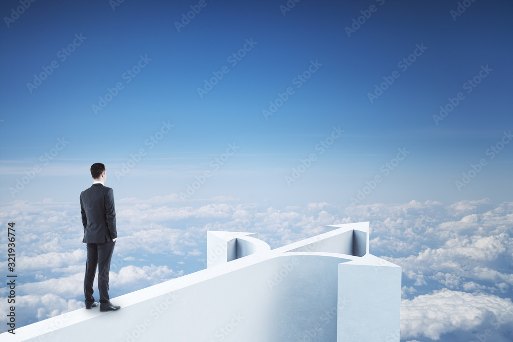 Businessman standing on abstract arrow