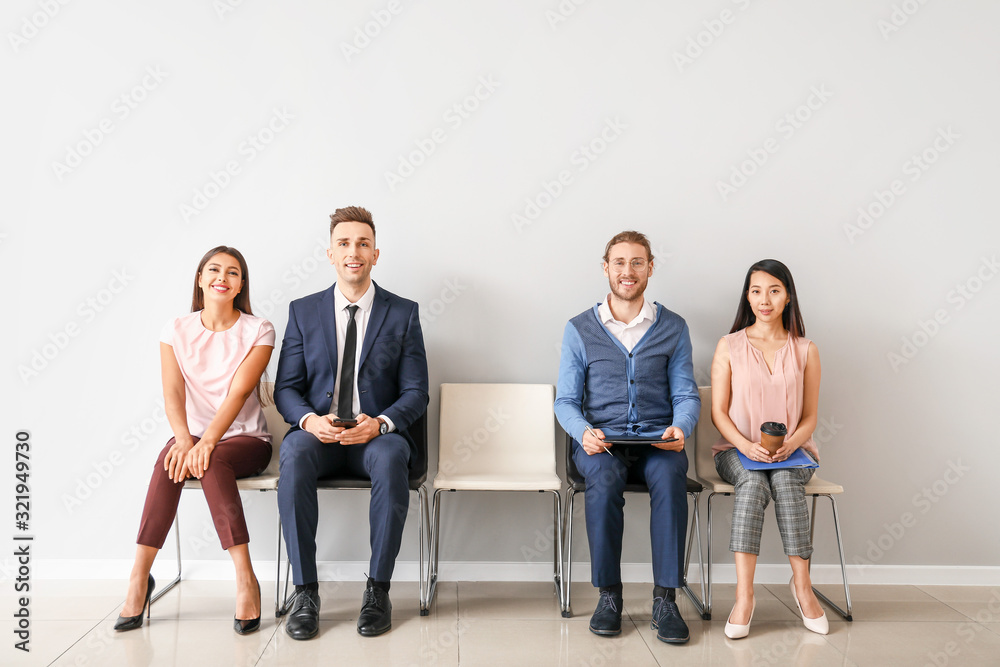 Young people waiting for job interview indoors