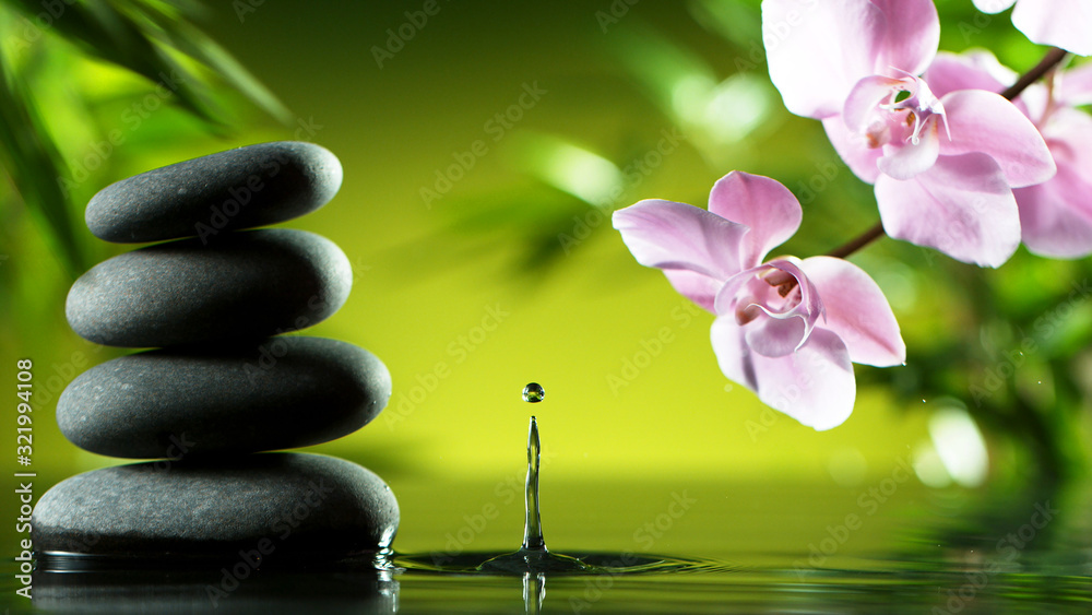 Dripping drops of water with black lava stones