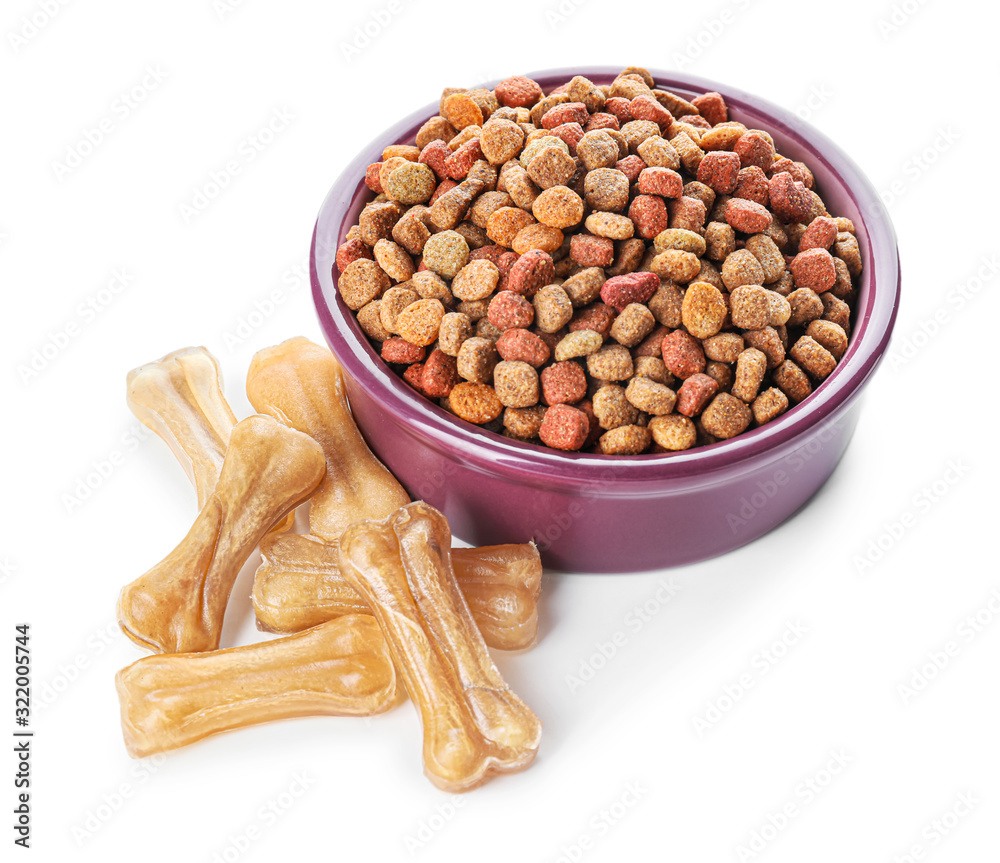 Bowl with dry pet food on white background