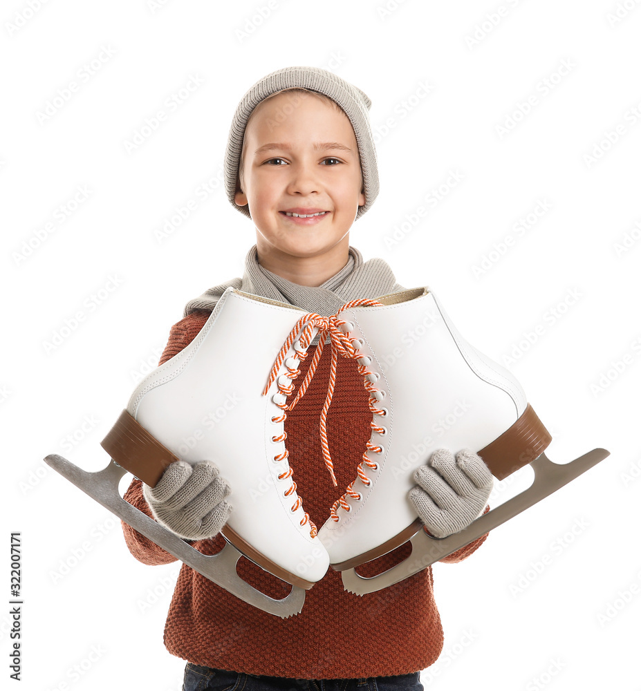 Cute little boy with ice skates against white background