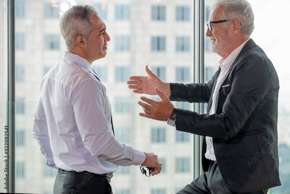 Two business man standing  at offic consult   business strategy on new project