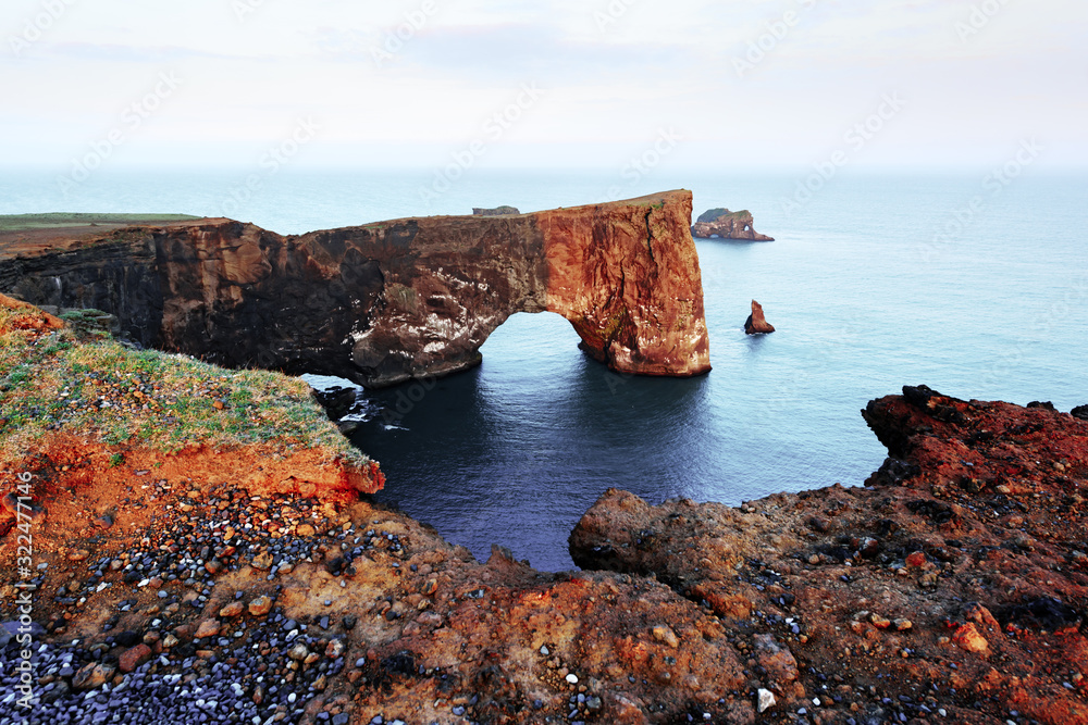 Gorgeous landscape with unique basalt arch on Dyrholaey Nature Reserve, Iceland, Europe