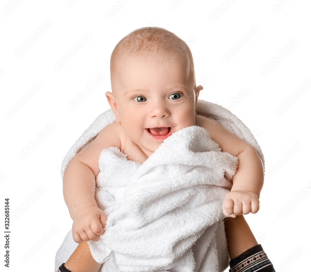 Portrait of cute little baby wrapped in towel on white background