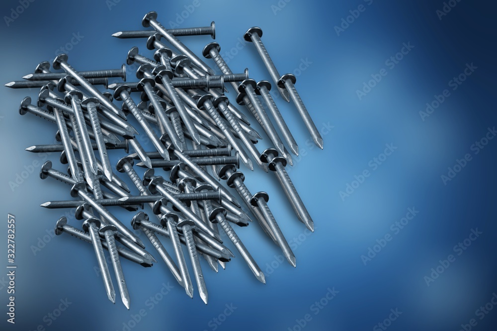 Construction metal nails on blur background