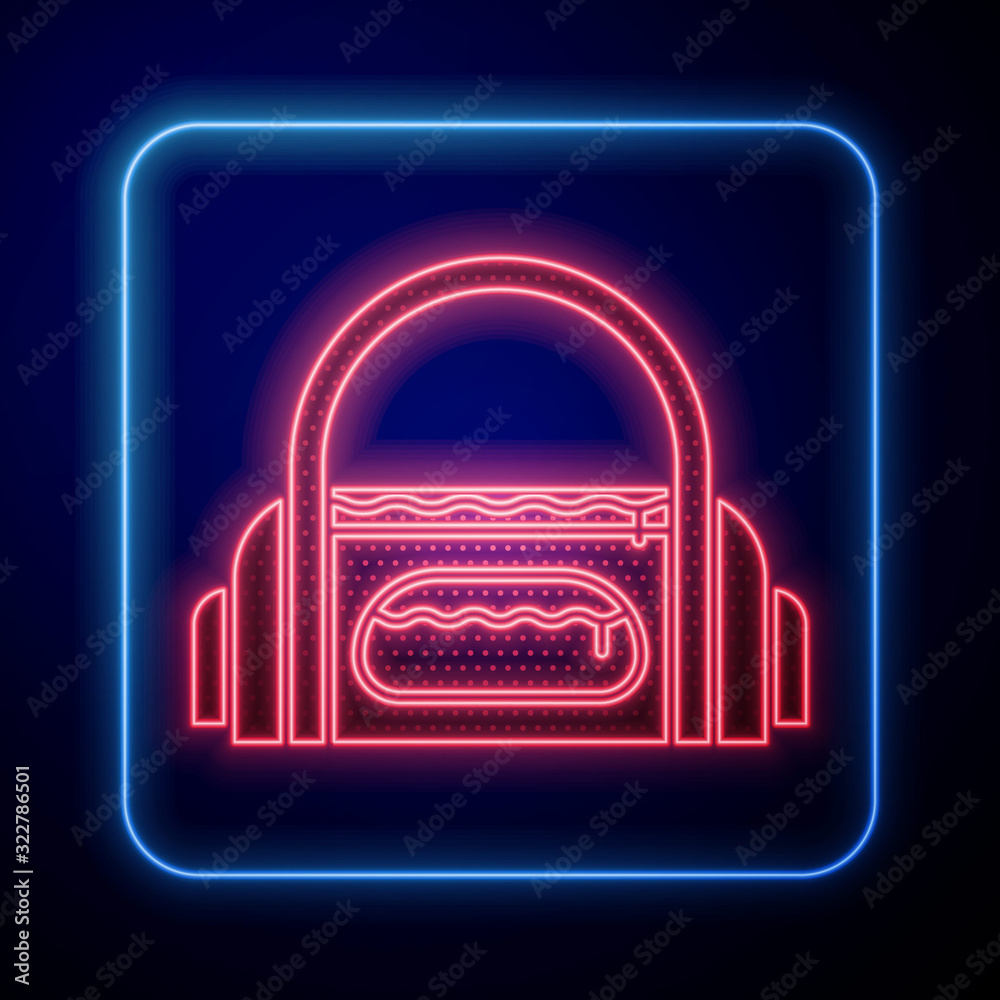 Glowing neon Sport bag icon isolated on blue background.  Vector Illustration