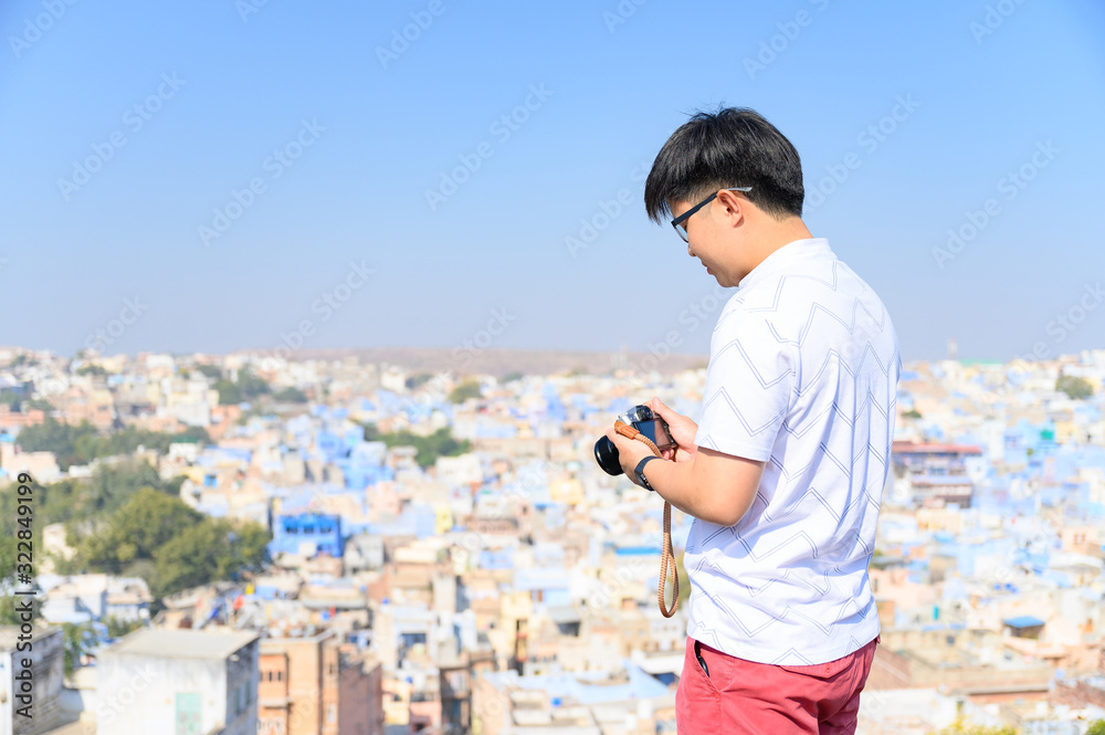 Young traveler capture photo of the blue city of Jodhpur in Rajasthan, India