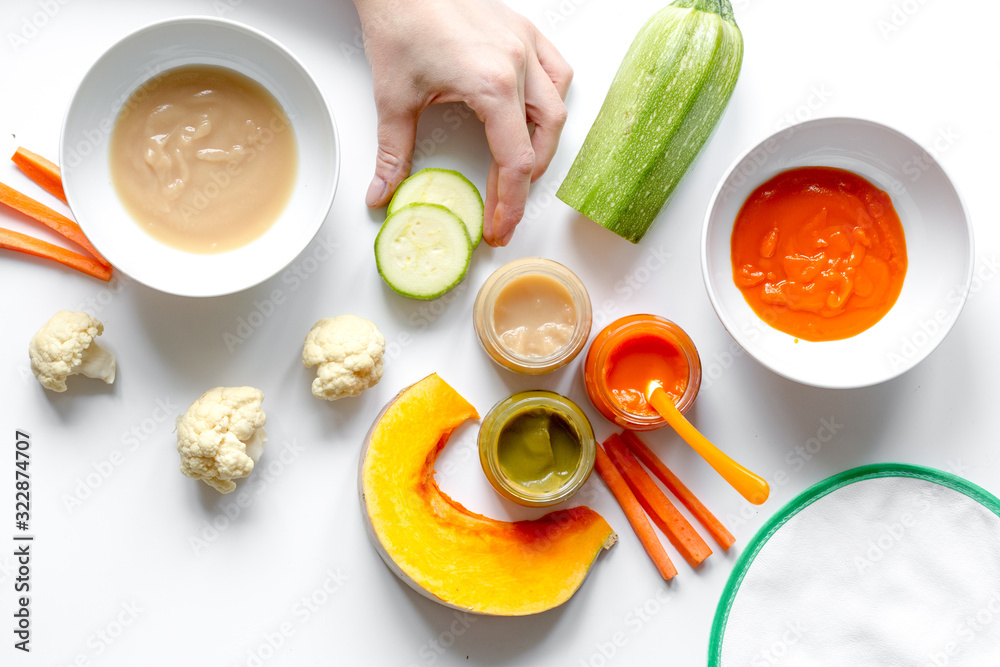 cooking vegetable puree for baby on white background top view