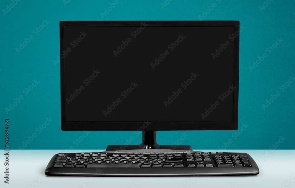 Modern desktop computer and keyboard on the desk