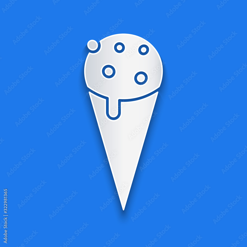 Paper cut Ice cream in waffle cone icon isolated on blue background. Sweet symbol. Paper art style. 