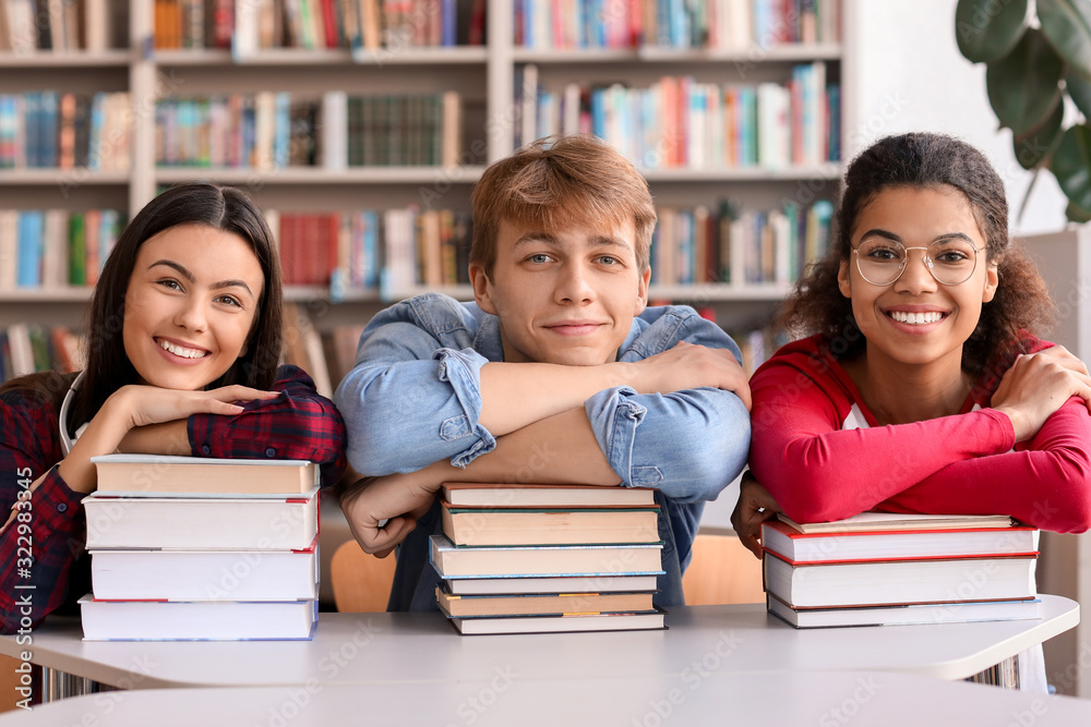 Young students with books in library