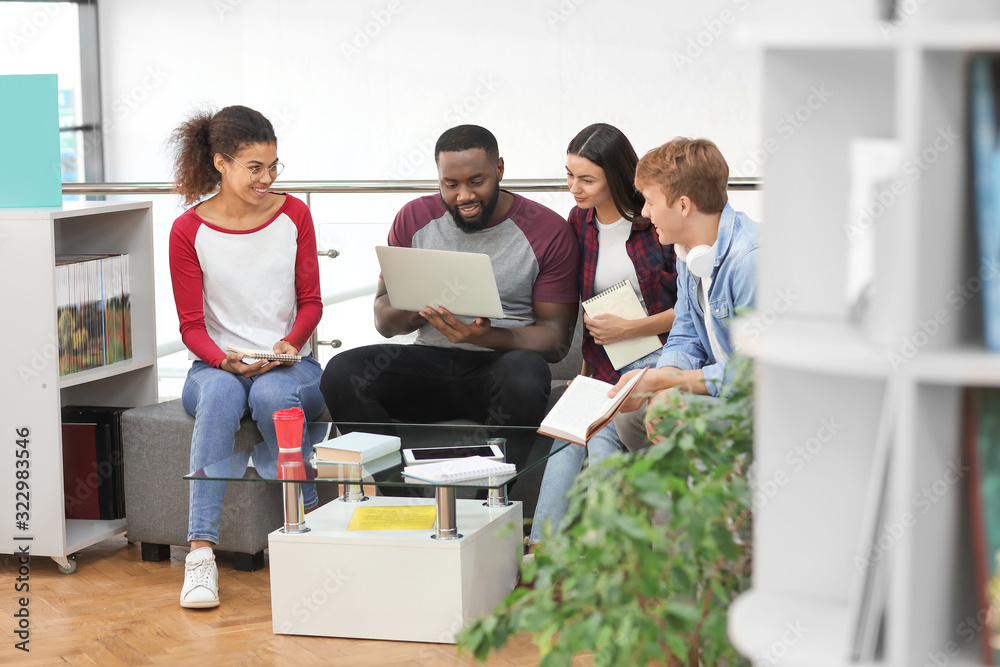 Young students preparing for exam in library