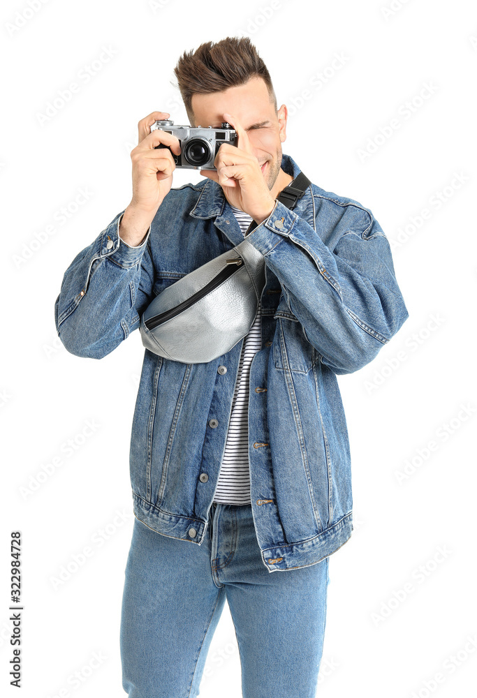 Male tourist with photo camera on white background