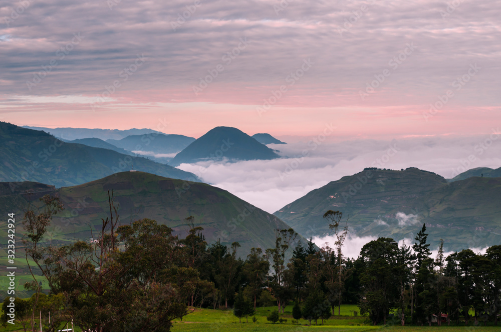 Road of the volcanoes in Ecuador / Volcanic landscape at sunrise on the way from Riobamba to Alausi,