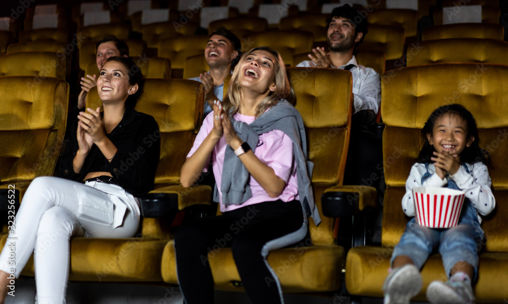 Group of audience happy and fun watch cinema in movie theater. Group recreation activity and enterta