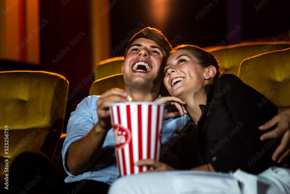 People audience watching movie in the movie theater cinema. Group recreation activity and entertainm