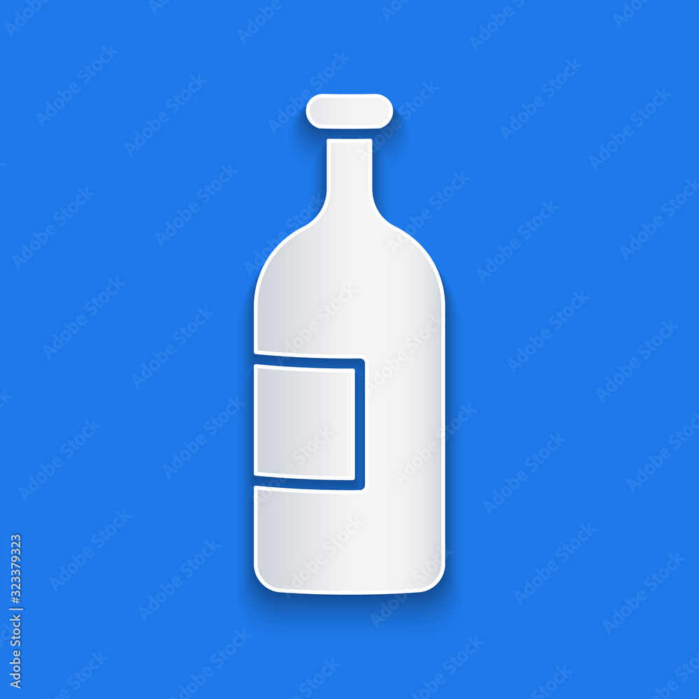 Paper cut Alcohol drink bottle icon isolated on blue background. Paper art style. Vector Illustratio