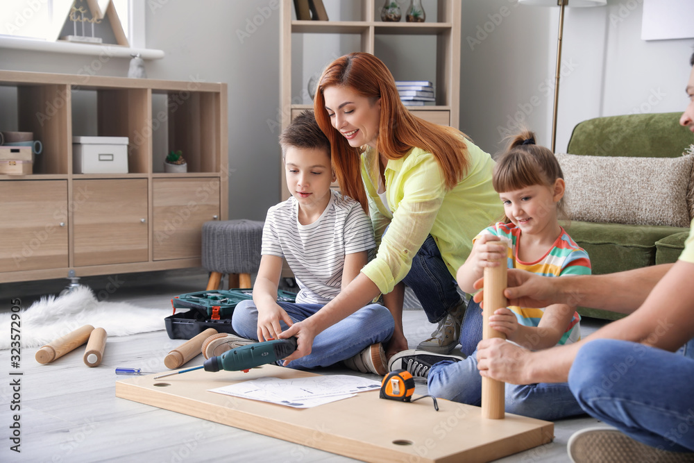 Family assembling furniture at home