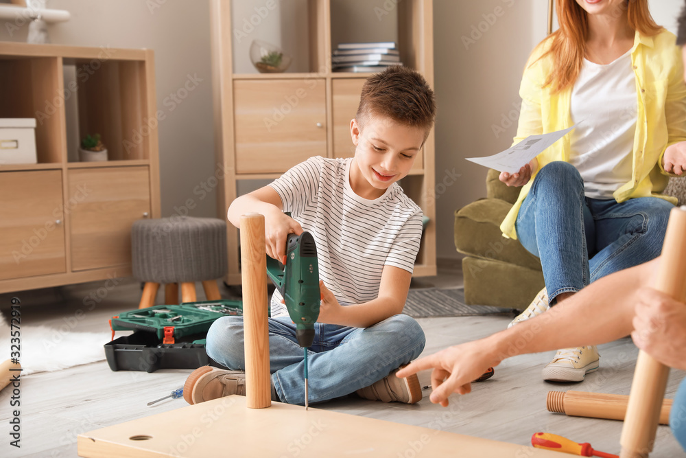 Family assembling furniture at home