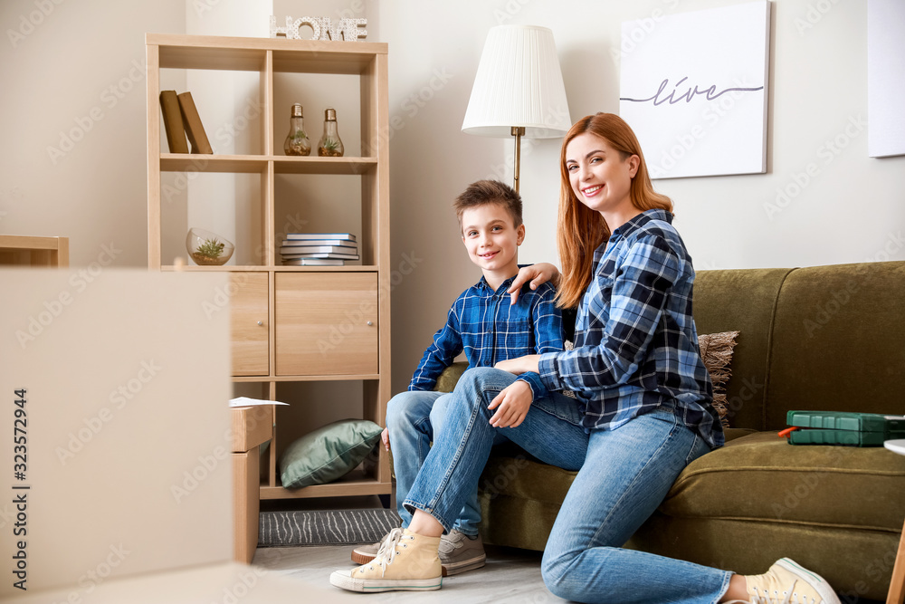 Mother and her little son after assembling furniture at home