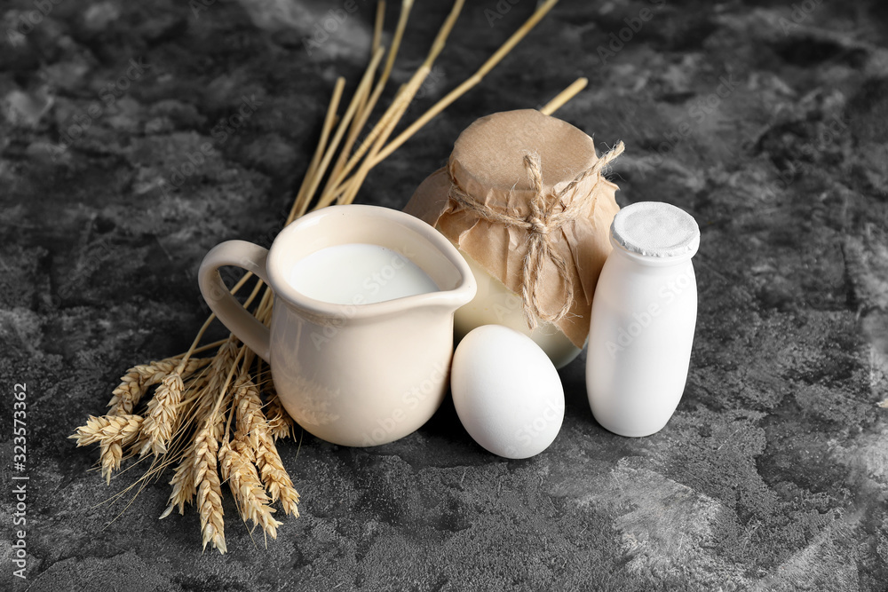 Different dairy products on grey background