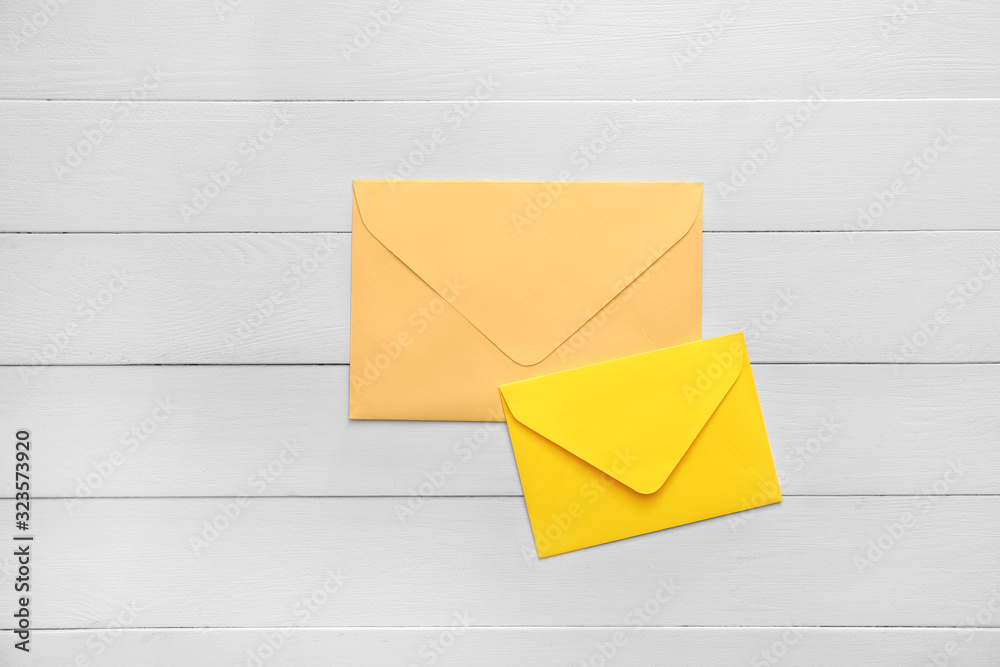 Paper envelopes on wooden background