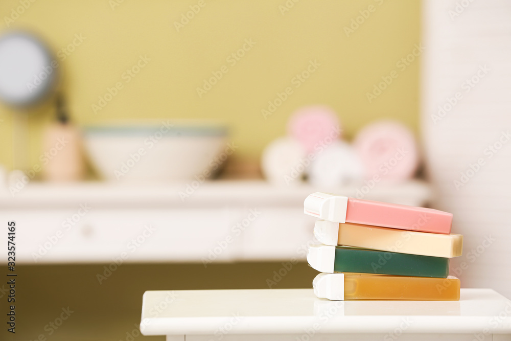 Liposoluble wax cartridges on table in bathroom