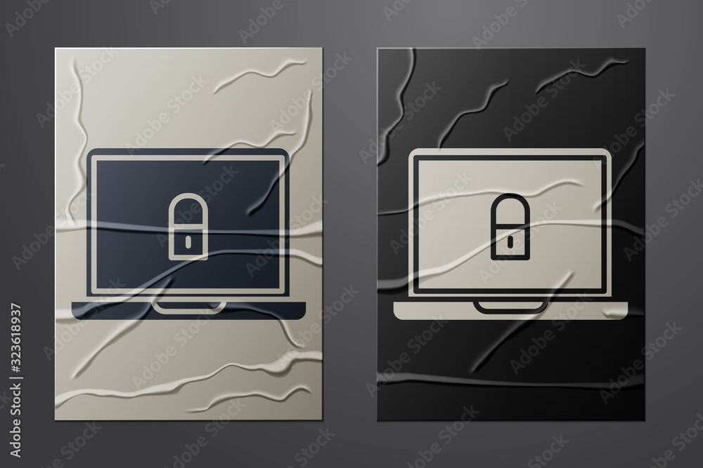 White Laptop and lock icon isolated on crumpled paper background. Computer and padlock. Security, sa