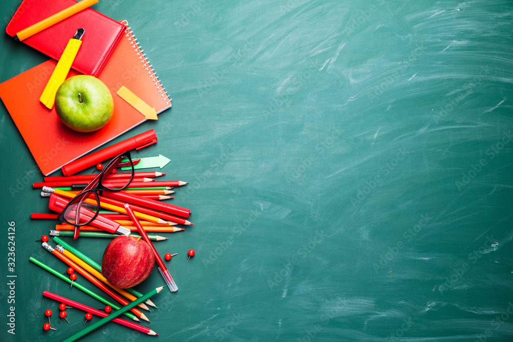 Set of stationery on school blackboard