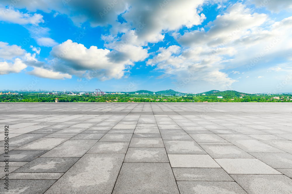 Empty square floor and city suburb skyline on a sunny day in Shanghai.