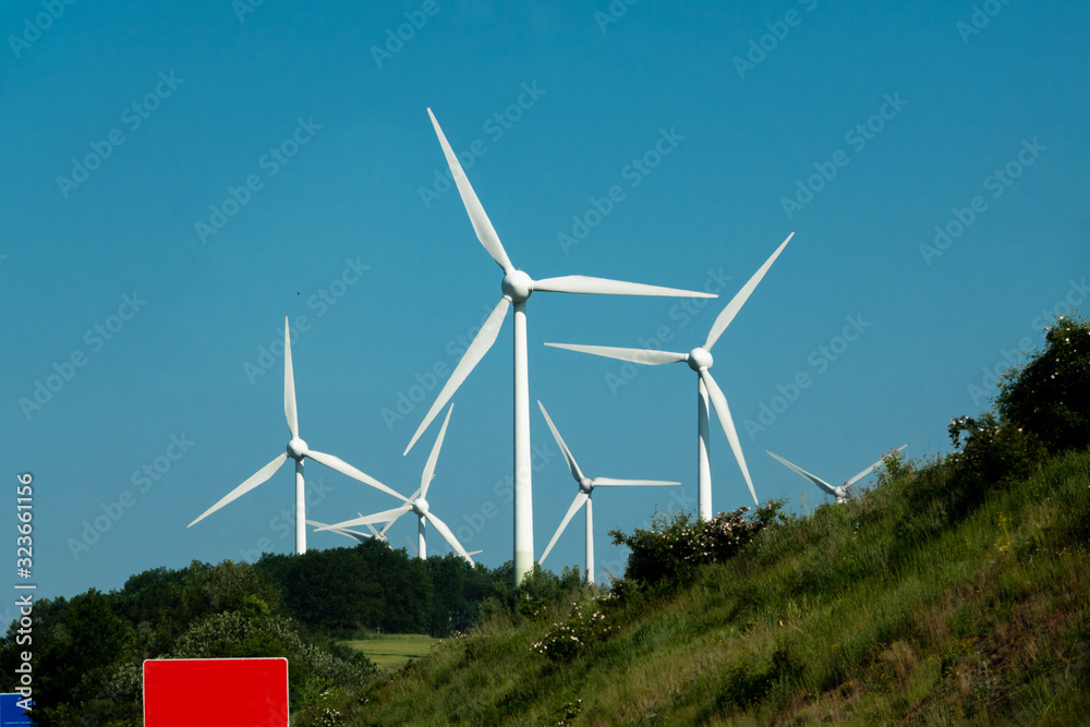 Wind power stations on a background of blue sky.