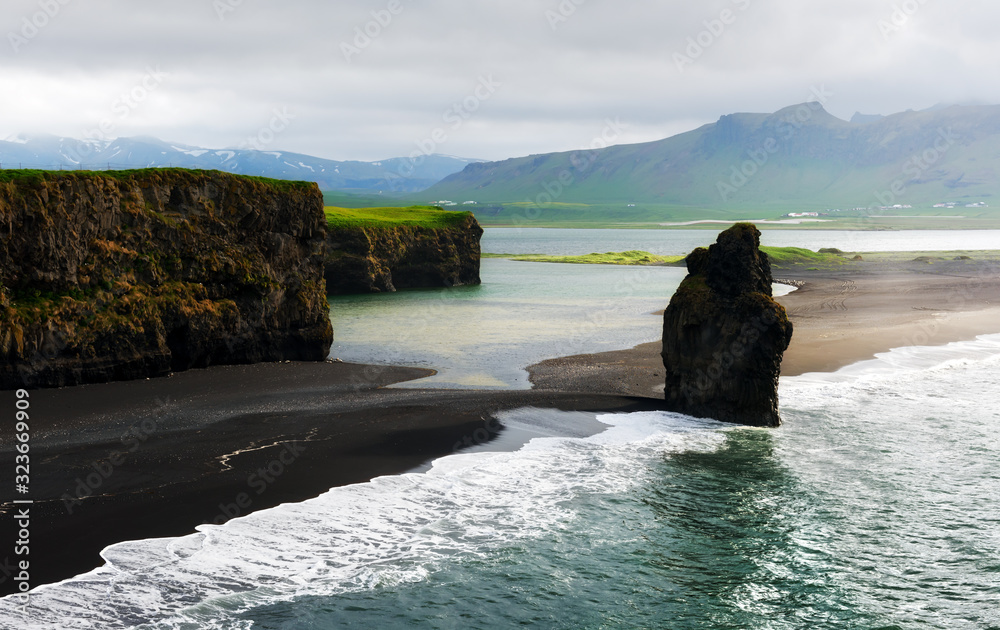 Gorgeous landscape with rocks and Atlantic ocean from southern coast of Iceland. Black beach, Reynis