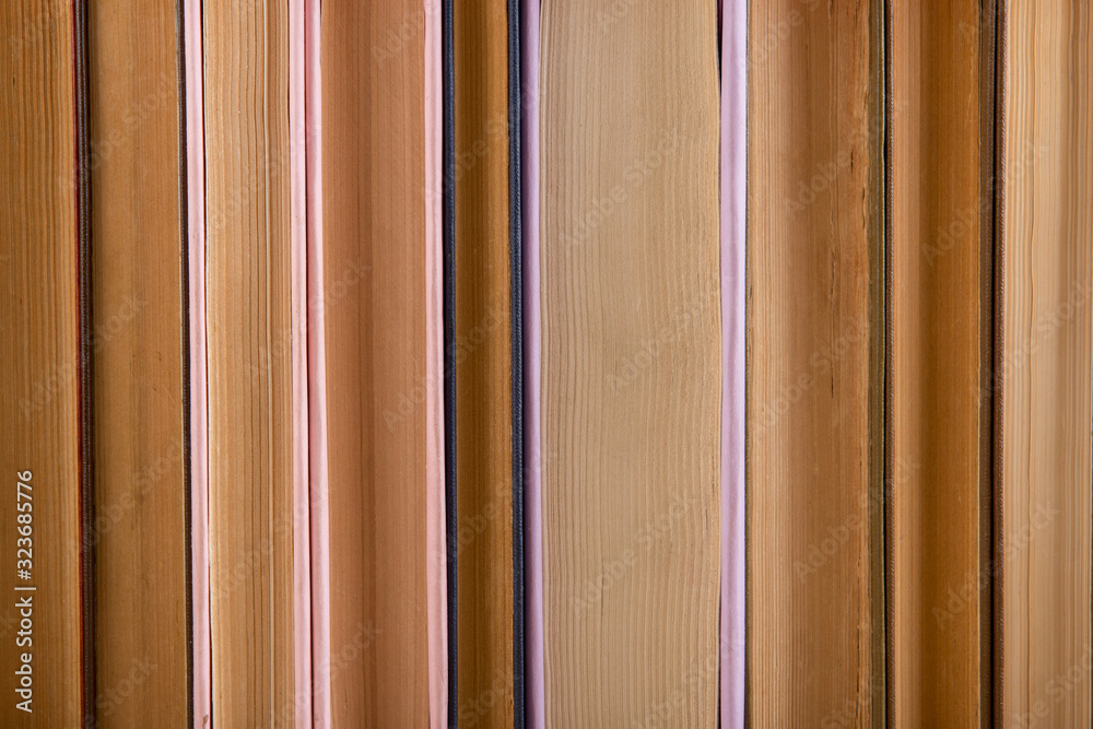 Colorful hardback and paperback books, close-up