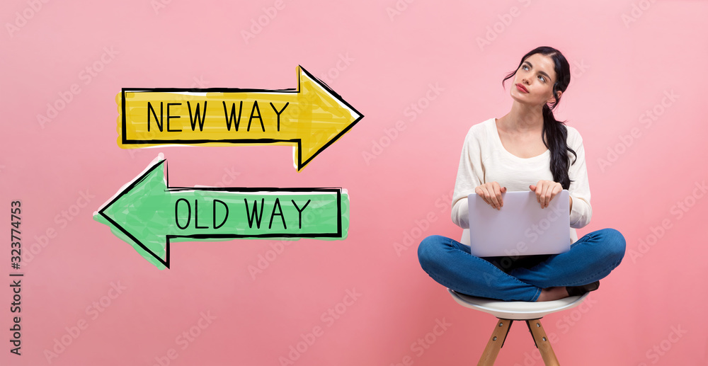 Old way or new way with young woman using a laptop computer