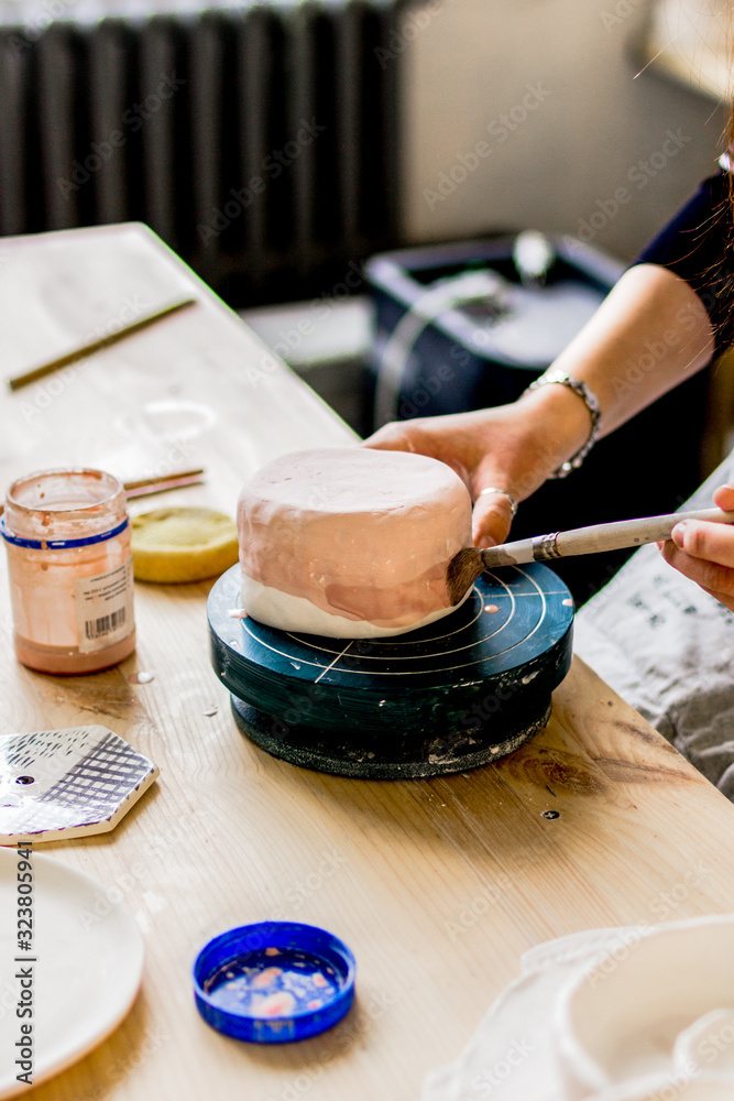 workshop production of ceramic tableware product painting