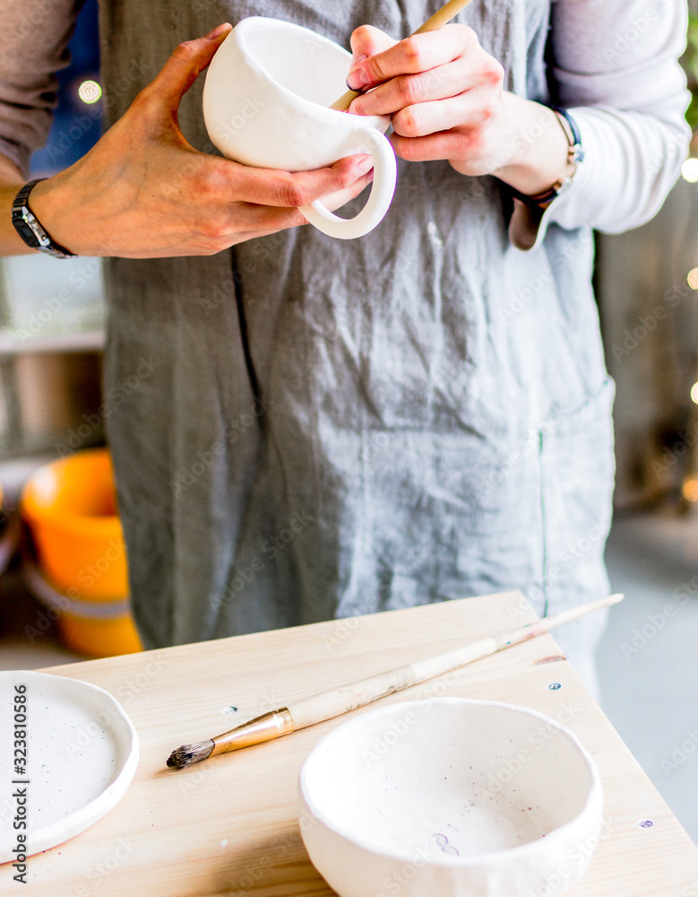 workshop production of ceramic tableware product painting