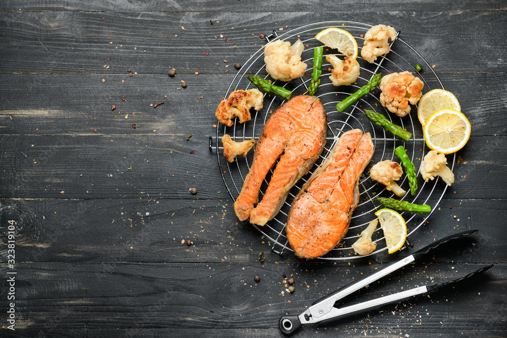 Composition with fried salmon on table