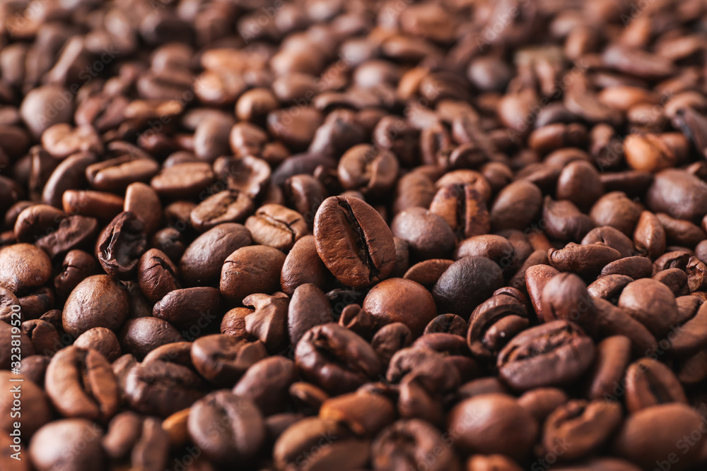 Many coffee beans as background