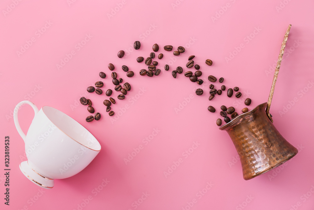 Cup, coffee beans and jezve on color background