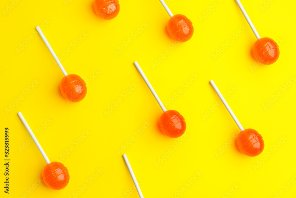 Tasty lollipops on color background