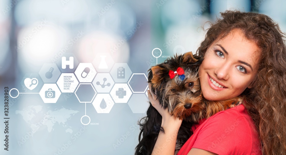 Young girl hugging small cute dog