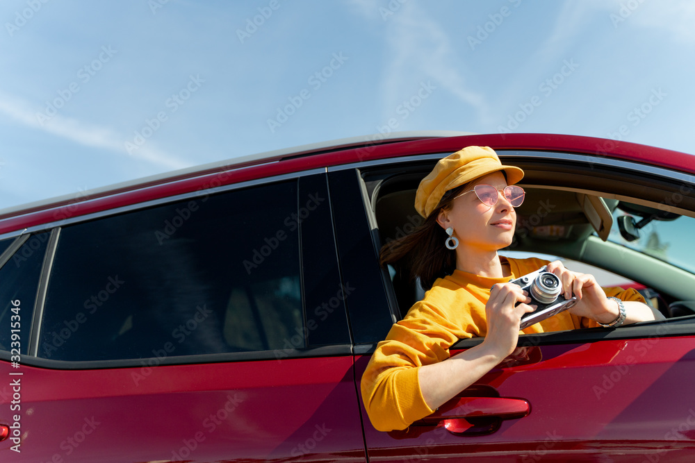 Young tourist with a camera