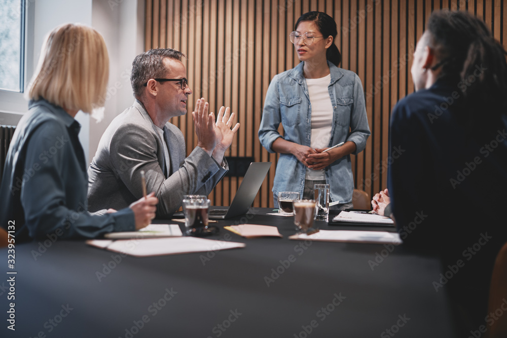 Diverse businesspeople discussing work during an office meeting