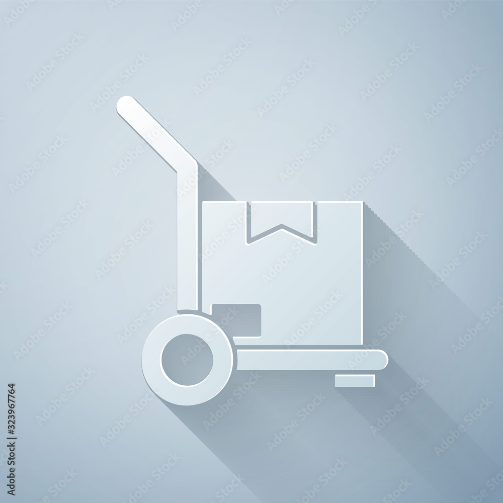 Paper cut Hand truck and boxes icon isolated on grey background. Dolly symbol. Paper art style. Vect