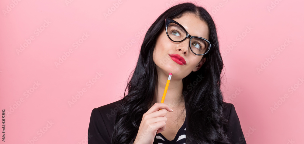 Office woman with a clipboard on a pink background