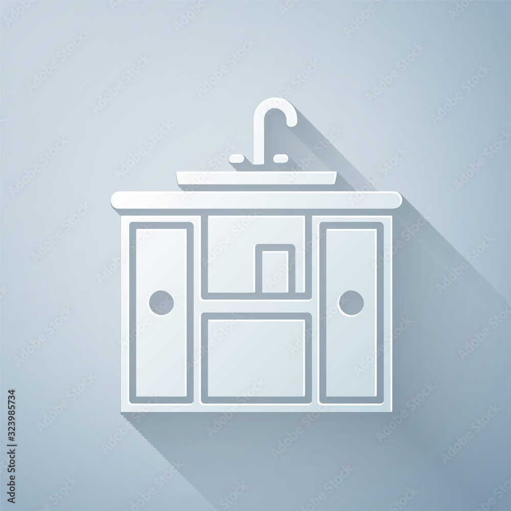 Paper cut Washbasin cabinet with water tap icon isolated on grey background. Paper art style. Vector