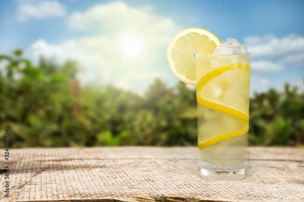 Lemonade with fresh slice lemon on desk