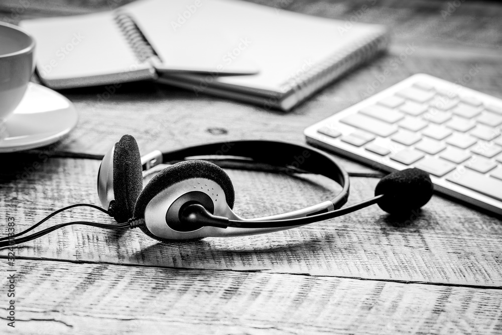 Call center support table with headset and keyboard