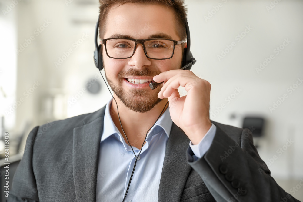 Portrait of male technical support agent in office