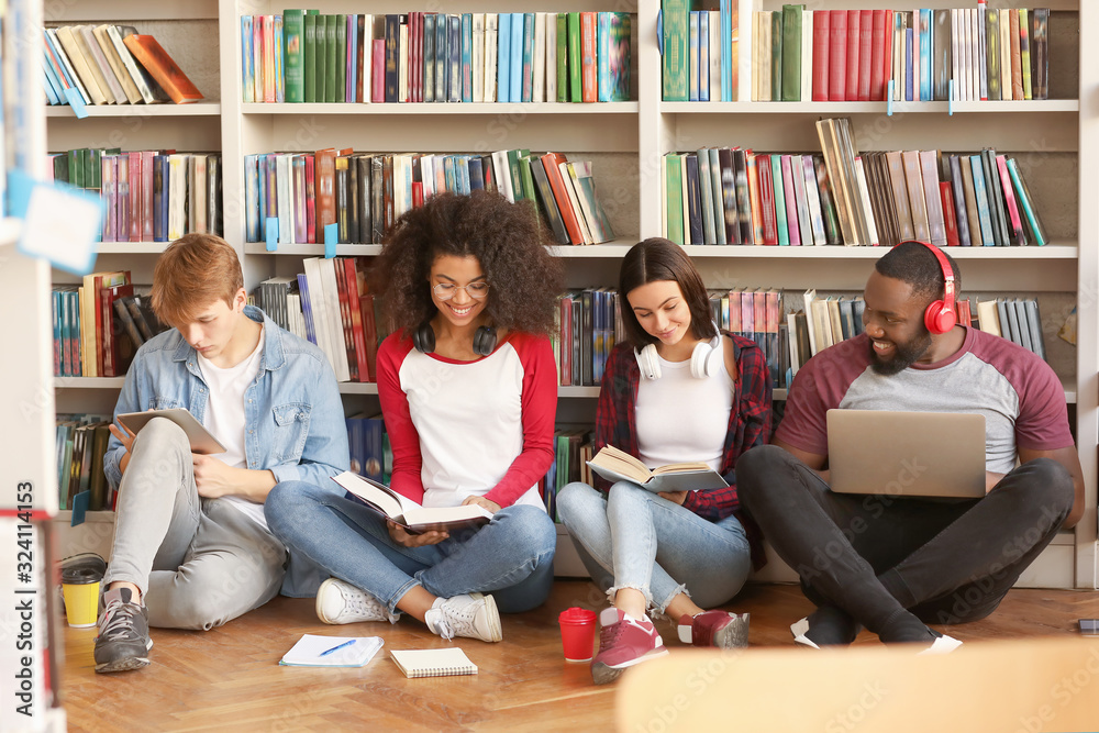 Young students preparing for exam in library